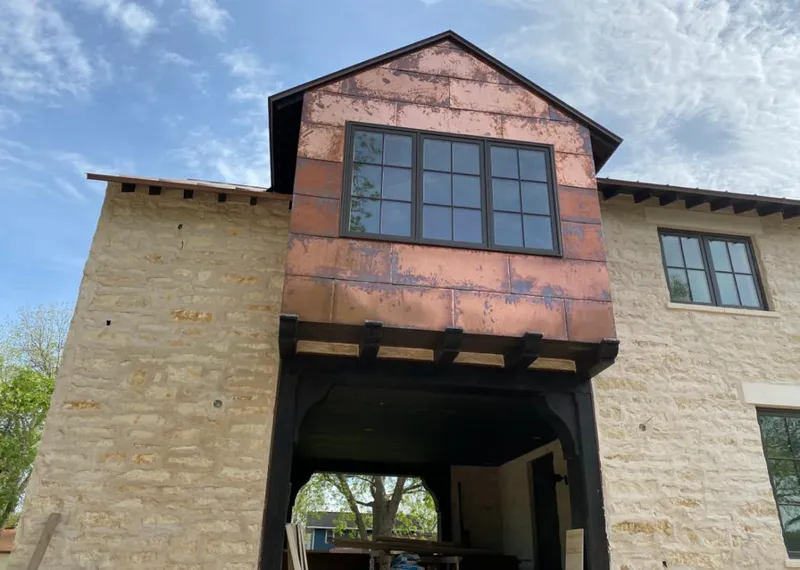Copper metal panel facade on a stone building for Skylight Installation in Sierra Vista Southeast